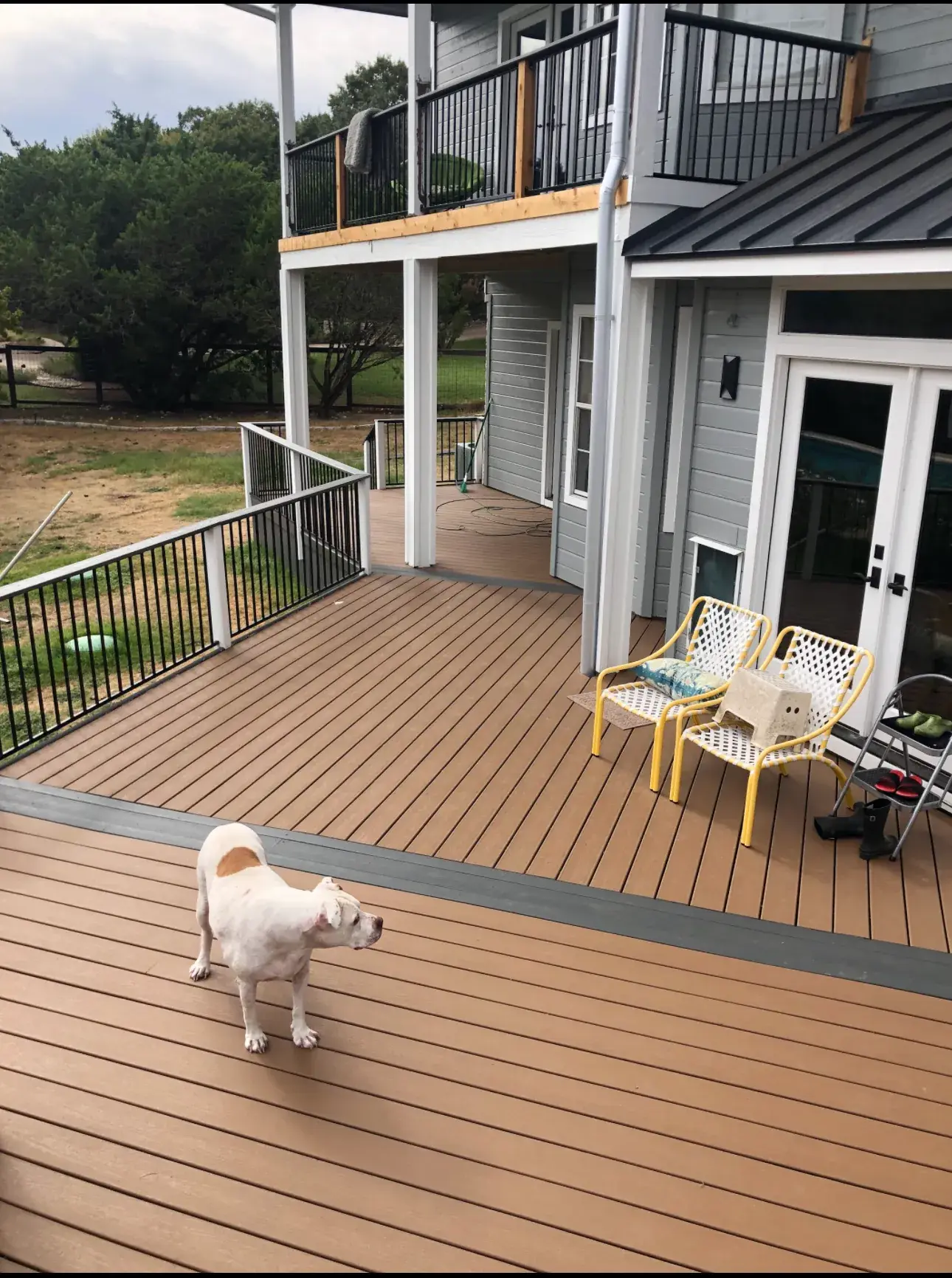 Elevated composite deck with metal railing